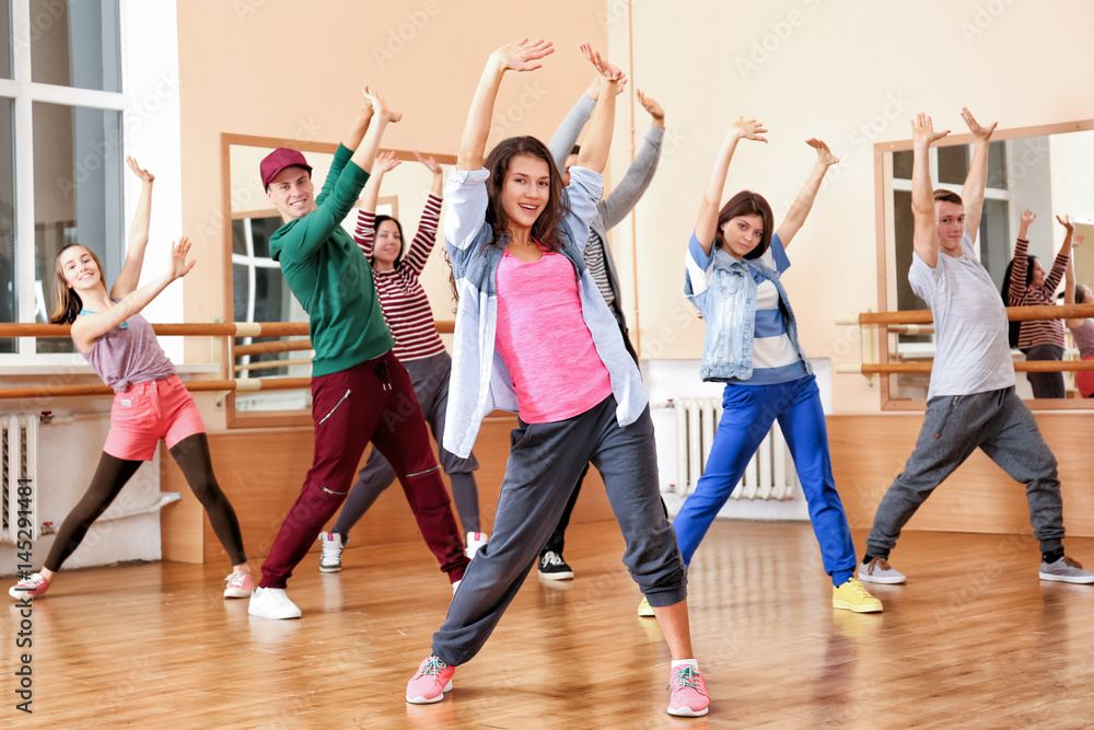 Group of young hip-hop dancers in studio