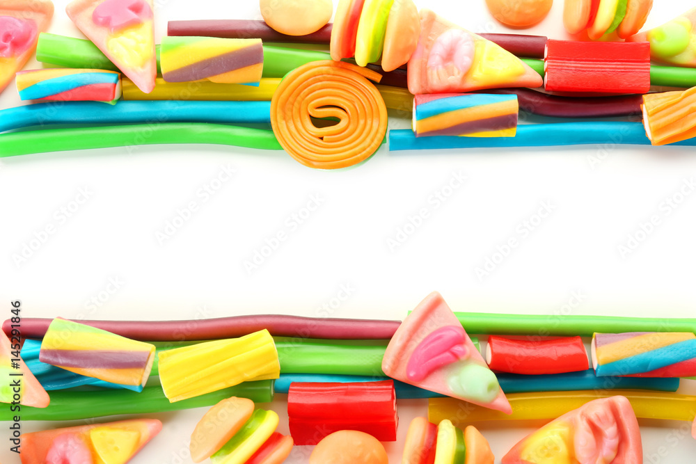 Composition of colorful jelly candies on white background