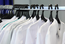 Medical Uniform On A Hangers In A Shop