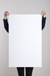 woman hand hold a blank poster