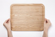 woman hand hold a wood tray isolated white.