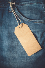 Empty brown paper tag of jean. vintage color effect style.