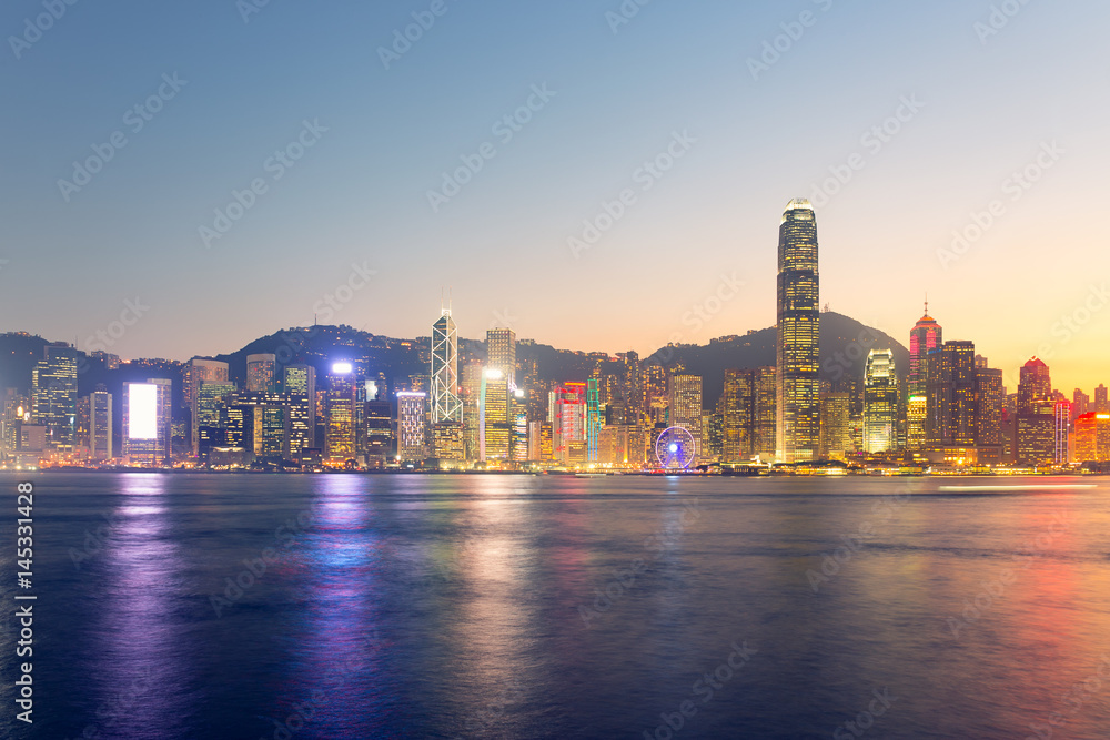 Fotovorhang - Cityscape and skyline at Victoria Harbour in Hong Kong city at twilight time.