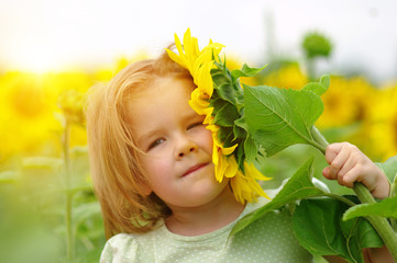 Wall Mural -  girl and sunflower on the field