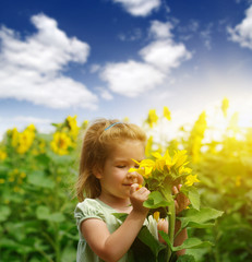 Wall Mural -  girl and sunflower on the field