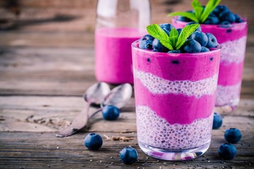 Canvas Print - Blueberry smoothies with chia pudding in glasses with fresh berries and mint