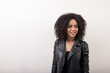 © Artem Varnitsin - Young woman with afro hairstyle wearing leather jacket