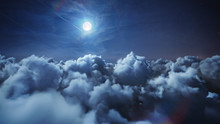 Flying Over The Deep Night Timelapse Clouds With Moon Light. Seamlessly Looped Animation. Flight Through Moving Cloudscape With Beautiful Moon. Perfect For Cinema, Background, Digital Composition.