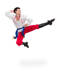 Wall Mural - young man wearing a folk costume jumping against isolated white with copyspace