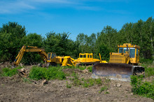 Mechanical Site Preparation For Forestry. Excavator And Bulldozer Clearing Forest Land.