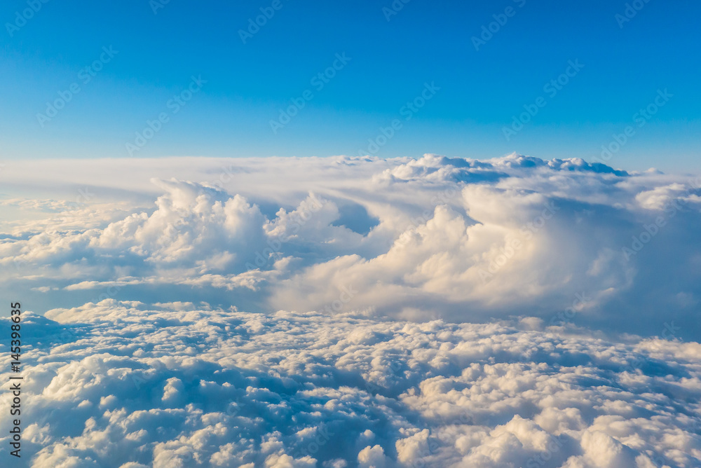 Widok z samolotu na chmury - obrazy, fototapety, plakaty 