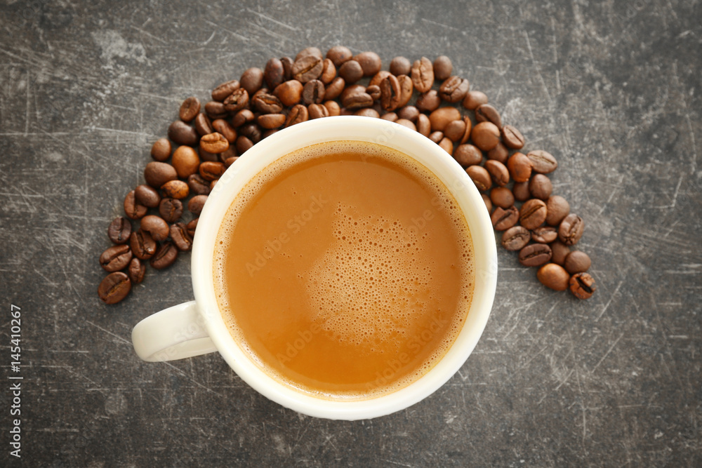 Cup of tasty butter coffee on grey background