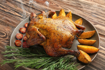 Sticker - Plate with roasted beer can chicken on wooden background