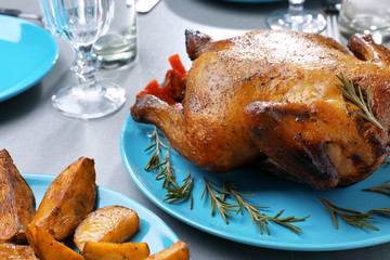 Poster - Plate with roasted beer can chicken on gray table