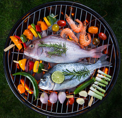 Wall Mural - Barbecue grill with sea fishes, close-up.