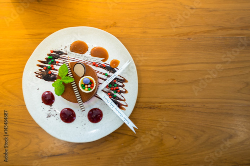 Tea Roll Cake Isolated On Ceramic Plate That Decorate With Cholate