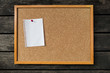 Notice board, blank white paper notepad on cork board