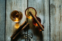 Studio Shot Of Whisky In A Glass And A Cigar In Ashtray Isolated On Black
