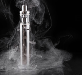 Wall Mural - electronic cigarette or vaping device within vapor on black background