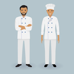 Wall Mural - Couple of male and female chefs standing together on a light background. Cooking characters. Restaurant team.