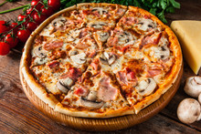 Traditional Italian Pizza With Ham And Mushrooms, Served On Rustic Wooden Table With Cherries, Cheese, Parsley And Peppercorns. Restaurant Menu Photo.