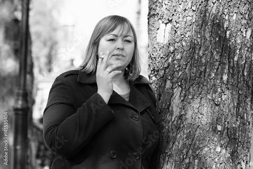 A Young Large Woman With Red Short Hair Size Plus A Size In Her