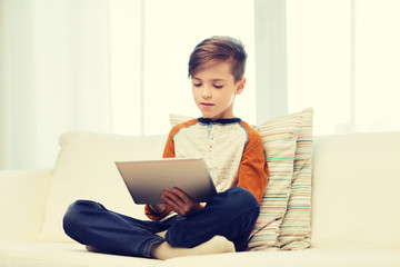 Poster - boy with tablet computer at home