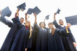© Syda Productions - happy students or bachelors waving mortar boards
