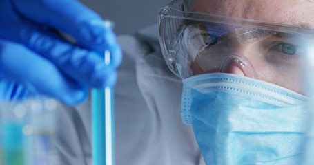 Wall Mural - close up of a scientist with futuristic graphics with which scans and reads the dna. concept: immers