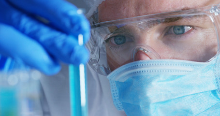 Wall Mural - close up of a scientist with futuristic graphics with which scans and reads the dna. concept: immers