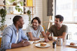 © Monkey Business - Three Male Friends Meeting For Lunch In Coffee Shop