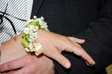 The bride and groom's hands with rings.