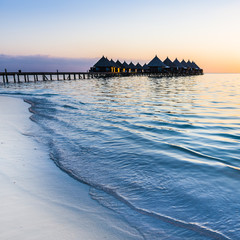 Wall Mural - Ari Atoll. Luxury resort in the Indian Ocean. Relax evening, sunset over the ocean. Maldives.