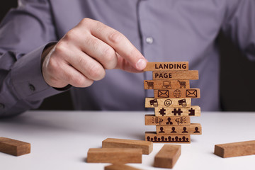  The concept of technology, the Internet and the network. Businessman shows a working model of business: Landing page