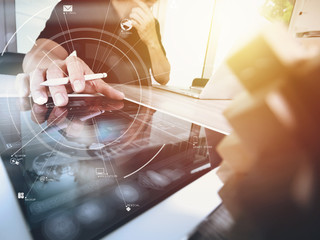 Poster - creative working with mobile phone and digital tablet and stylus pen on wooden desk in modern office with virtual icon diagram