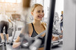 © Yakobchuk Olena - Outgoing woman training with pulldown station