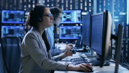 Wall Mural - In the System Control Center Technical Support Team Gives Instructions by Headsets. Shot on RED EPIC-W 8K Helium Cinema Camera.