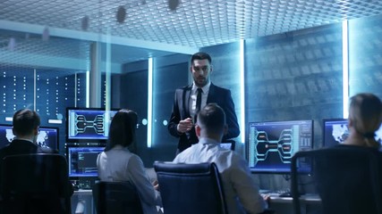 Aufkleber - Supervisor Holds Briefing for His Employees in System Control Center Full of Monitors and Servers. Possibly Government Agency Conducts Investigation. Shot on RED EPIC-W 8K Helium Cinema Camera.