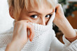 blonde young woman wearing sweater