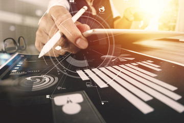 Poster - businessman working with mobile phone and digital tablet and laptop computer on wooden desk in modern office with virtual icon diagram