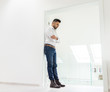© Jasmin Merdan - Attractive young man posing in white modern interior