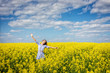 Carefree woman in rapeseed field