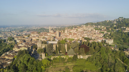 Drone aerial view of Bergamo - Old city. One of the beautiful city in Italy. Landscape on the city center, its historical buildings and towers during a wonderful blu day