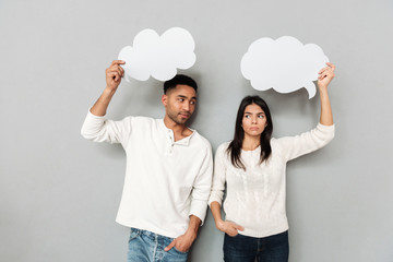 Wall Mural - MAn looking at his upset woman isolated