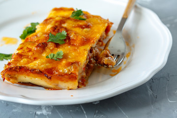 Wall Mural - Greek style moussaka with eggplants, ground beef and potatoes.