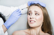© pavelgulea - Doctor aesthetician trying to make head beauty injections to female patient