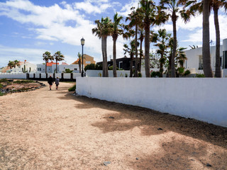 Long walk along a beautiful beach and elegant houses