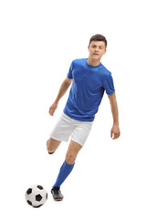 Poster - Teenage soccer player kicking a football