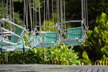 Empty Swing In Theme Park