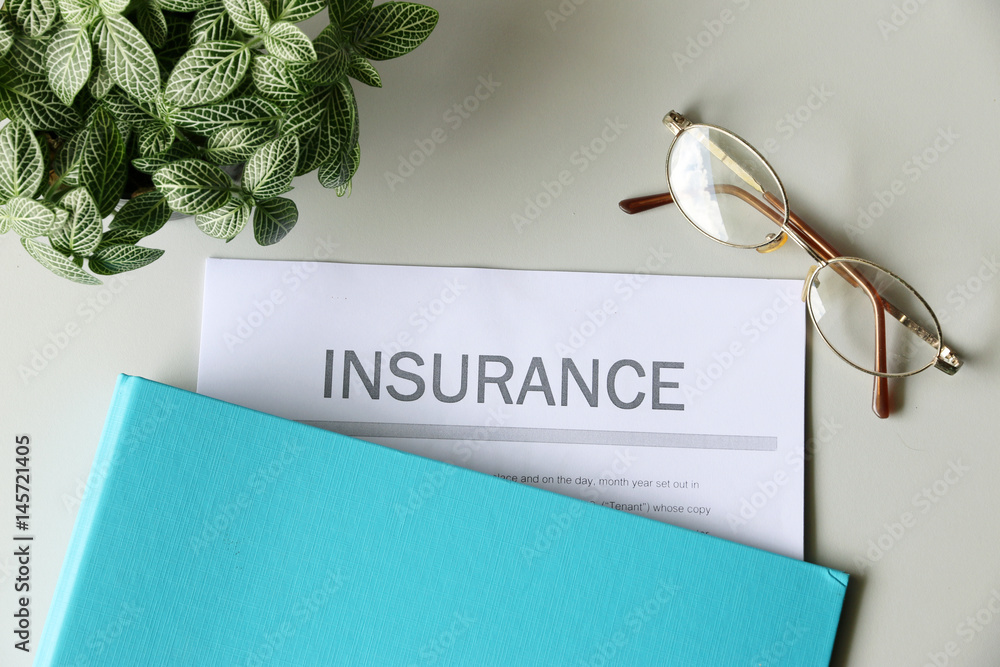 Insurance paper on the desk Stock Photo | Adobe Stock